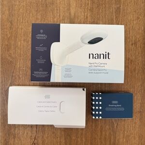 Nanit Pro Camera with Wall Mount - White, unused! New in box plus extra swaddles